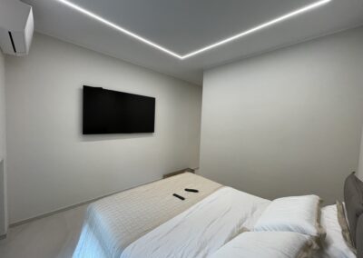 Impianto illuminazione LED Milano Cologno Monzese con strisce soffitto colore freddo lavoro camera da letto ristrutturazione design